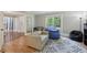 Inviting living room with hardwood floors, stylish rug, comfortable seating, and natural light at 4261 Vineyard Trl, Snellville, GA 30039
