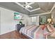 Spacious main bedroom features a TV, tray ceiling, ensuite bathroom, and ample closet space at 4261 Vineyard Trl, Snellville, GA 30039