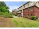 Expansive backyard with lush greenery and a stone patio, perfect for outdoor enjoyment at 4960 Tadmore Ln, Lithonia, GA 30038