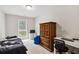 This cozy bedroom has a comfortable bed, closet, desk, and a bright window view at 4960 Tadmore Ln, Lithonia, GA 30038