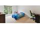 Bright bedroom with a window view, and comfortable furniture at 4960 Tadmore Ln, Lithonia, GA 30038