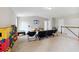 Spacious bonus room is shown with gray walls and multiple seating options at 4960 Tadmore Ln, Lithonia, GA 30038