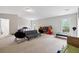 Bright bonus room with comfortable seating, play zone, and plentiful natural light at 4960 Tadmore Ln, Lithonia, GA 30038