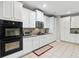 Well-equipped kitchen featuring granite countertops, double ovens, and ample cabinetry at 4960 Tadmore Ln, Lithonia, GA 30038