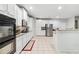 Modern kitchen showcasing stainless steel appliances, granite countertops, and white cabinetry at 4960 Tadmore Ln, Lithonia, GA 30038