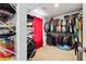 Spacious walk-in closet with ample storage, shelving, and hanging rods for all your wardrobe needs at 4960 Tadmore Ln, Lithonia, GA 30038