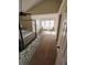 Cozy bedroom with a large window, vaulted ceilings, neutral paint, and modern furniture and decor at 5320 Taylor Rd, Alpharetta, GA 30022