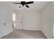Well-lit bedroom featuring a ceiling fan and closet access, ready for personalization at 5320 Taylor Rd, Alpharetta, GA 30022