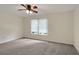 Cozy bedroom with neutral tones and a ceiling fan, offering a serene living space at 5320 Taylor Rd, Alpharetta, GA 30022