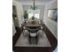 Bright dining room featuring a modern chandelier and a wood dining table at 5320 Taylor Rd, Alpharetta, GA 30022