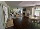 Open-concept living room with a fireplace, hardwood floors, and neutral décor at 5320 Taylor Rd, Alpharetta, GA 30022