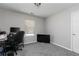 Small, neutrally painted bedroom featuring a window and carpeted floors at 2412 Wingfield Dr, Austell, GA 30106