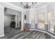 Open dining room with decorative trim, hardwood floors, natural light, and crown molding at 2412 Wingfield Dr, Austell, GA 30106