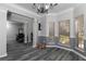 Open dining room with decorative trim, hardwood floors, natural light, and crown molding at 2412 Wingfield Dr, Austell, GA 30106