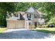 Charming two-story home featuring a two-car garage and well-manicured lawn at 2412 Wingfield Dr, Austell, GA 30106