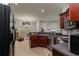 Open kitchen featuring granite countertops, stainless steel appliances and dark wood cabinets at 2412 Wingfield Dr, Austell, GA 30106