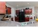 Open kitchen featuring granite countertops and dark wood cabinets at 2412 Wingfield Dr, Austell, GA 30106