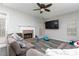 Cozy living area features wood-look floors, brick fireplace, and neutral color scheme at 2412 Wingfield Dr, Austell, GA 30106