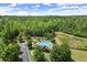 Aerial view showcasing the community pool, playground, and lush greenery of the neighborhood at 2660 Burnt Hickory Dr, Cumming, GA 30028