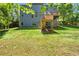 Spacious backyard featuring a lush lawn, deck, and exterior of the home at 2660 Burnt Hickory Dr, Cumming, GA 30028