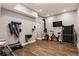 Basement with exercise area including various fitness equipment and dark wood flooring at 2660 Burnt Hickory Dr, Cumming, GA 30028