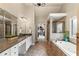 Luxurious primary bathroom featuring a double vanity, soaking tub, and a separate glass-enclosed shower at 2660 Burnt Hickory Dr, Cumming, GA 30028