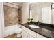 This bathroom features a granite countertop, tiled shower and tub combination at 2660 Burnt Hickory Dr, Cumming, GA 30028