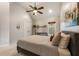 Bedroom featuring a queen-size bed, a large window, and two double doors at 2660 Burnt Hickory Dr, Cumming, GA 30028