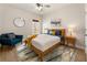 Cozy bedroom features stylish furniture, wood floors, and lots of natural light at 2660 Burnt Hickory Dr, Cumming, GA 30028
