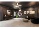 Stylish bonus room with dark walls, modern decor, and plush carpeting at 2660 Burnt Hickory Dr, Cumming, GA 30028