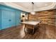 Game room showcasing a ping pong table, wet bar, coffered ceilings and wood paneling at 2660 Burnt Hickory Dr, Cumming, GA 30028