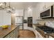 Spacious kitchen highlighting large island, granite countertops, and stainless-steel appliances at 2660 Burnt Hickory Dr, Cumming, GA 30028