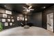 Chic sitting room offers a contemporary vibe with an area rug, decor, recessed lighting, and dark walls at 2660 Burnt Hickory Dr, Cumming, GA 30028