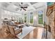 Bright and airy living room with hardwood floors, stone fireplace, and coffered ceilings at 2660 Burnt Hickory Dr, Cumming, GA 30028