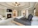 Main bedroom with fireplace, sitting area, and entry to main bathroom at 2660 Burnt Hickory Dr, Cumming, GA 30028