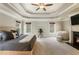 Spacious main bedroom with tray ceiling, fireplace, windows and carpeted floors at 2660 Burnt Hickory Dr, Cumming, GA 30028