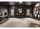 Stylish office showcasing dark accent walls, recessed lighting, built-in shelves and windows at 2660 Burnt Hickory Dr, Cumming, GA 30028