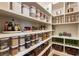 Organized pantry with ample shelving, baskets, and clear containers for storage at 2660 Burnt Hickory Dr, Cumming, GA 30028