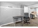 Unfinished basement area, painted grey with a table and chair at 526 Lakeside Dr, Hiram, GA 30141