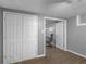 View into the unfinished basement from a closet; unfinished flooring and painted walls at 526 Lakeside Dr, Hiram, GA 30141
