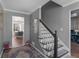 Inviting foyer featuring hardwood floors, staircase, and view into the dining room at 526 Lakeside Dr, Hiram, GA 30141