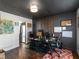 This is an office area that has a dark ceiling, wood floor, with decorum and a kitchen view at 526 Lakeside Dr, Hiram, GA 30141