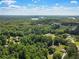 A beautiful aerial shot of a landscape with buildings and trees at 6637 Oak Farm Se Dr, Acworth, GA 30102