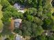 An aerial view of a home nestled among lush, mature trees at 6637 Oak Farm Se Dr, Acworth, GA 30102