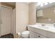Neutral full bathroom with a door to outside, tiled floors, and a vanity with a large mirror at 6637 Oak Farm Se Dr, Acworth, GA 30102
