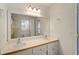Bathroom boasting a large mirror, double sinks, white cabinets, and clean modern design at 6637 Oak Farm Se Dr, Acworth, GA 30102