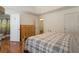 Spacious bedroom with en suite access and wood flooring, showcasing a decorative metal bed frame at 6637 Oak Farm Se Dr, Acworth, GA 30102