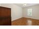 Bedroom with wood flooring, bright walls, a large closet, and a dark wood wardrobe at 6637 Oak Farm Se Dr, Acworth, GA 30102