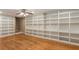 Bonus room with hardwood floors and custom built-in shelving, offering storage and display space at 6637 Oak Farm Se Dr, Acworth, GA 30102