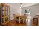 The dining area includes wood floors, access to the deck, modern lighting, and a built-in display cabinet at 6637 Oak Farm Se Dr, Acworth, GA 30102